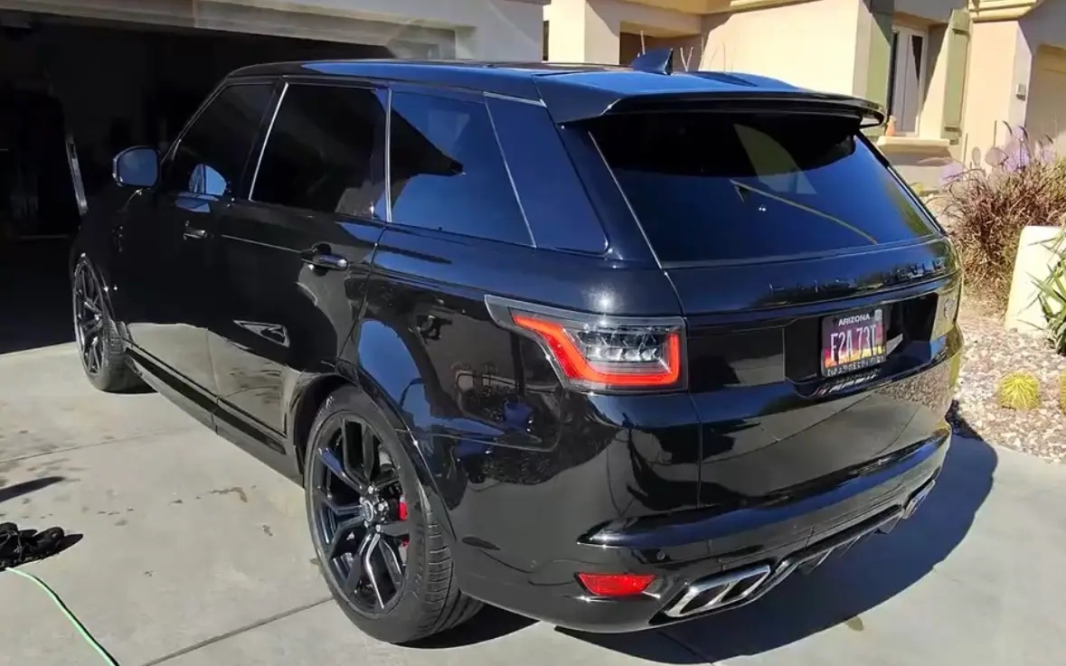 Machine polished glossy paint on black Range Rover